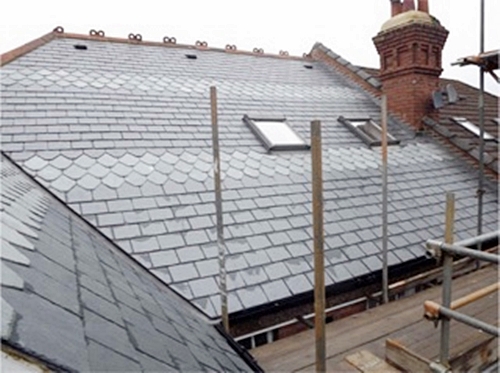 New slate roof in Spanish slate with pattern.