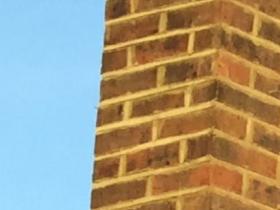 Lead step flashing and repointing on chimney stack.